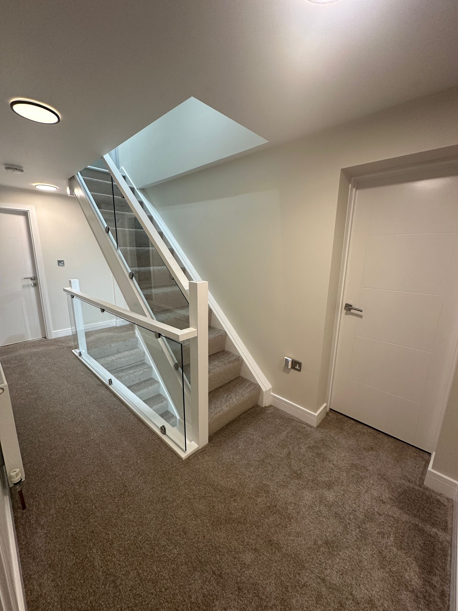 Staircase, hallway, landing and bedrooms — residential interior
